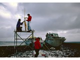 Bathymetric Survey, 9 April-12 May 1987 : At Elizabeth Reef sand cay installing the Magnavox equipment over the ground mark NM/OS/109; on scaffold (L-R) Peter Kaczerepa and Steve Yates. 